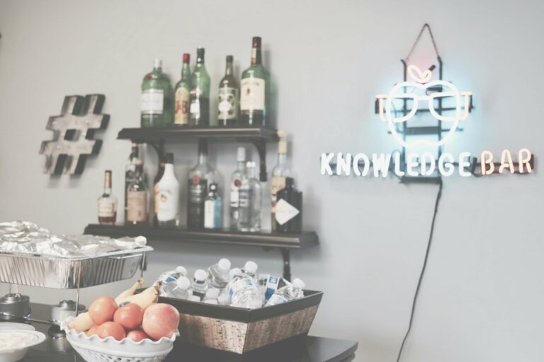 A bar setup with a neon sign reading "Knowledge Bar" inside the Web Development workspace.