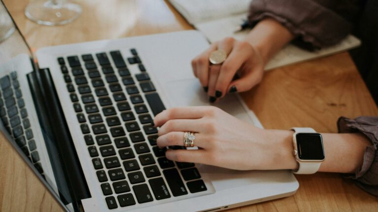 Person reading captivating content on a laptop