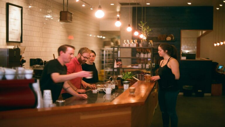 Customers sampling local products at tasting station