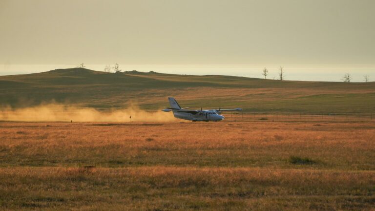 Small aircraft landing on a rural airstrip, symbolizing the importance of high-quality backlinks for seamless digital connectivity