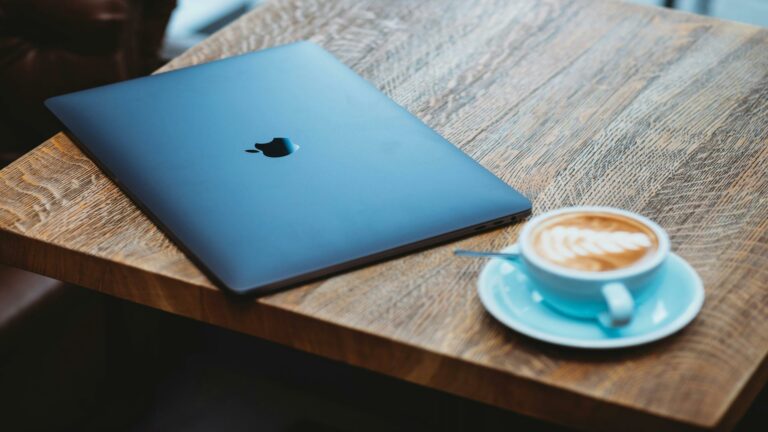 Social media optimization with a laptop and coffee