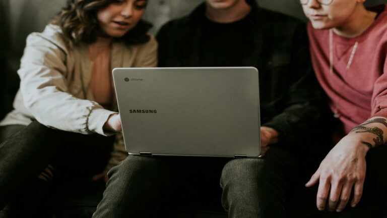 Three people using a Samsung Chromebook