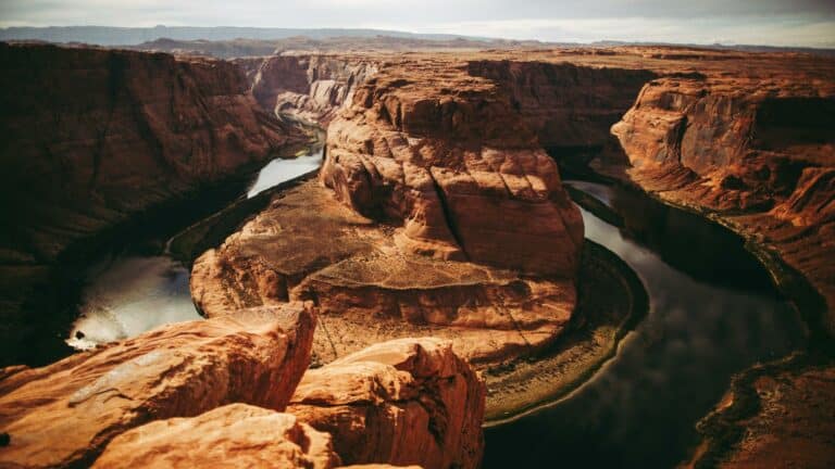 Aerial view of a winding river through a canyon