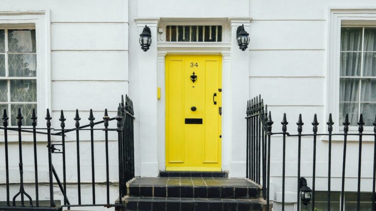 Local London business entrance with bright yellow door and traditional architecture, perfect for targeting local customers