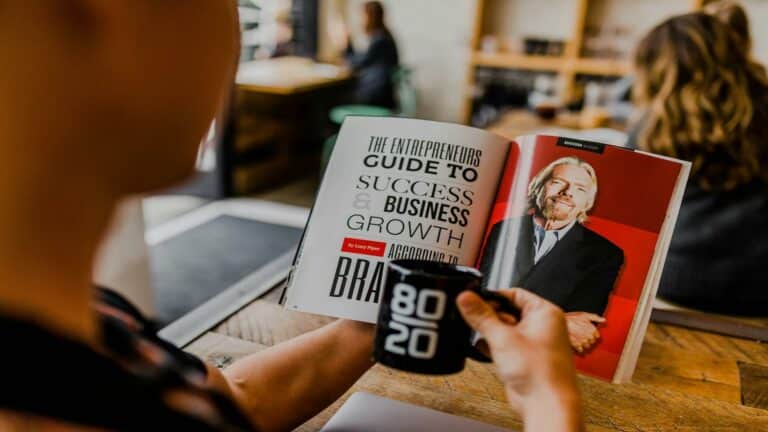 Targeted email marketing book showing entrepreneurial success strategies with coffee mug on wooden desk