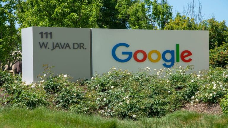 Google headquarters sign at 111 W. Java Dr with greenery in the background