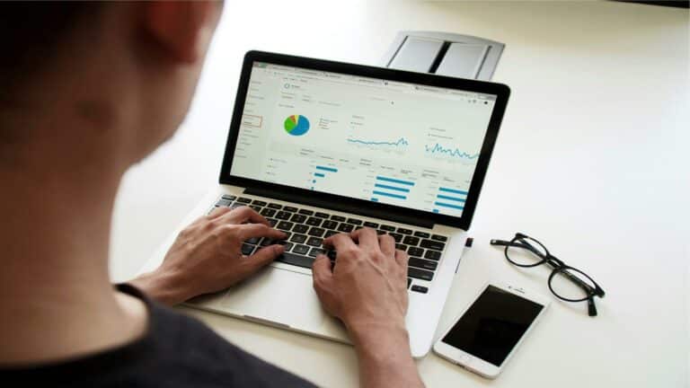 Person analyzing data on a laptop screen for web design in London