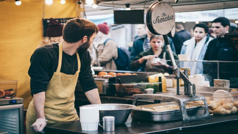 Build online presence with a street food vendor showcasing culinary offerings at a market stall