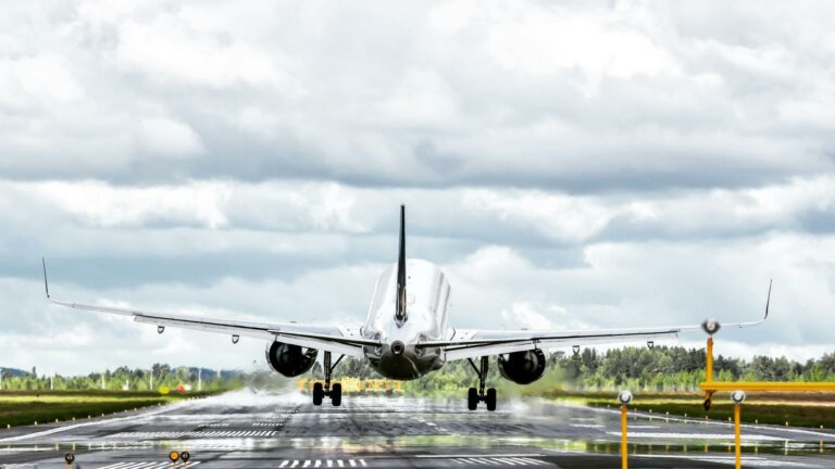 High-quality backlinks and web design services represented by an airplane taking off on a runway, symbolizing growth and success.