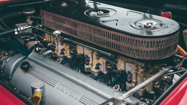 Close-up of a classic Ferrari engine showcasing intricate design and engineering