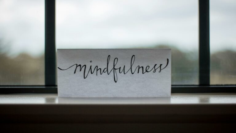 Mindfulness concept on a card placed on a window ledge, representing focus and clarity in website design services