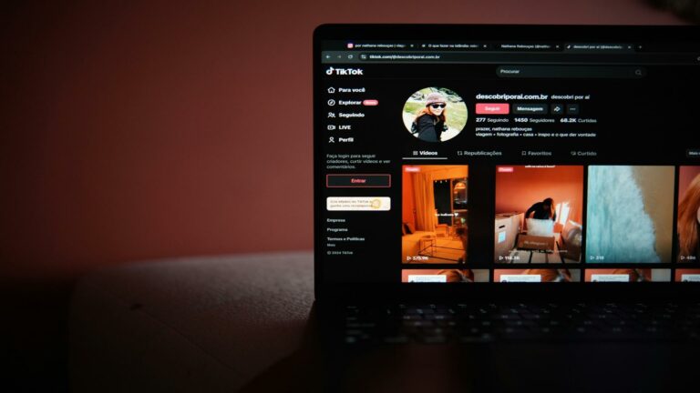 Mobile site optimization example showing TikTok's responsive web interface displayed on a laptop screen in dark mode