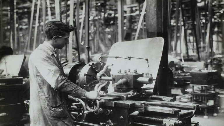 Worker operating machinery in a factory, showcasing effective SEO tactics for industrial web design