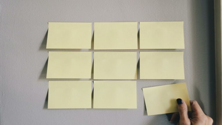 Post-it notes arranged on a wall for social media engagement planning