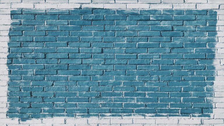 Blue painted brick wall showcasing optimize image sizes concept