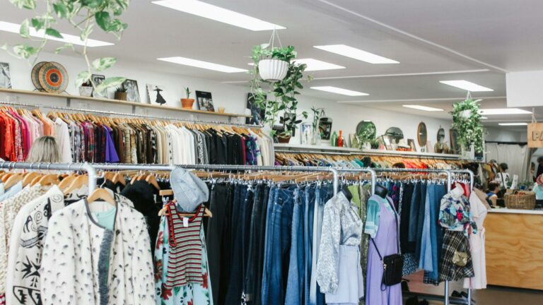 Thrift store interior highlighting business marketing strategies with organized racks and vibrant decor.