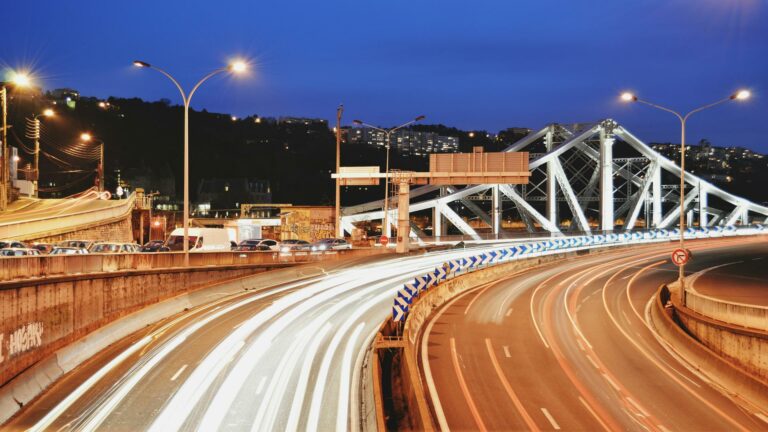 Traffic and bridge in London at night showcasing vibrant city life, ideal for search engine marketing strategies