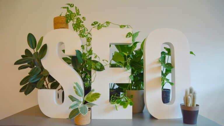 SEO letters surrounded by plants representing website design principles