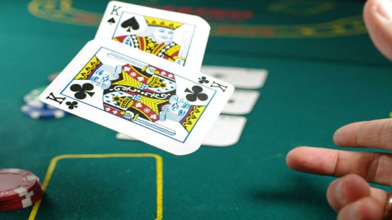 Playing cards on a poker table to increase online sales with strategic web design