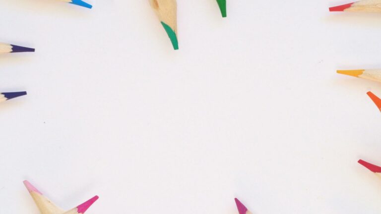 Local business marketing concept with colorful pencils arranged in a circle on a white background