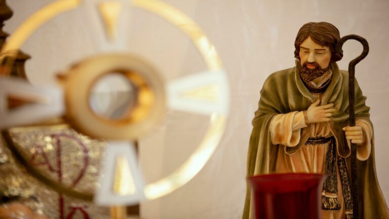 Statue of a shepherd holding a staff, enhancing user engagement through religious and cultural symbolism