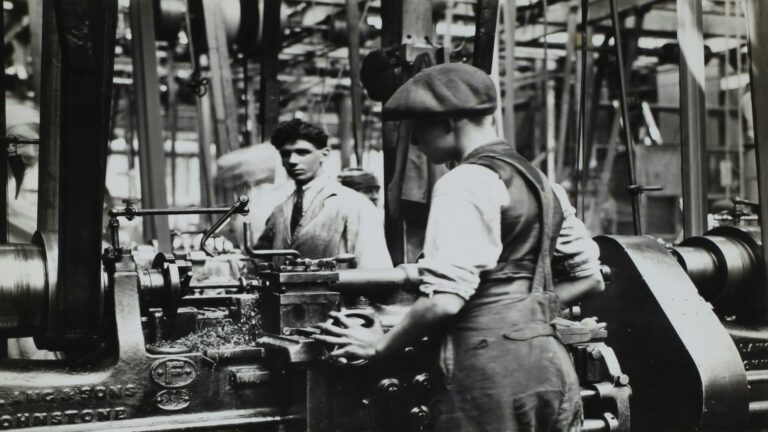 Factory workers operating machinery during the Industrial Revolution in London