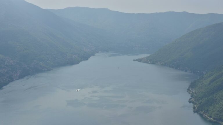 Aerial view of a tranquil lake surrounded by mountains