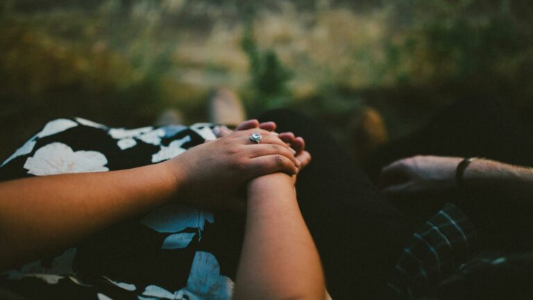 Create engaging content with a serene moment of holding hands outdoors