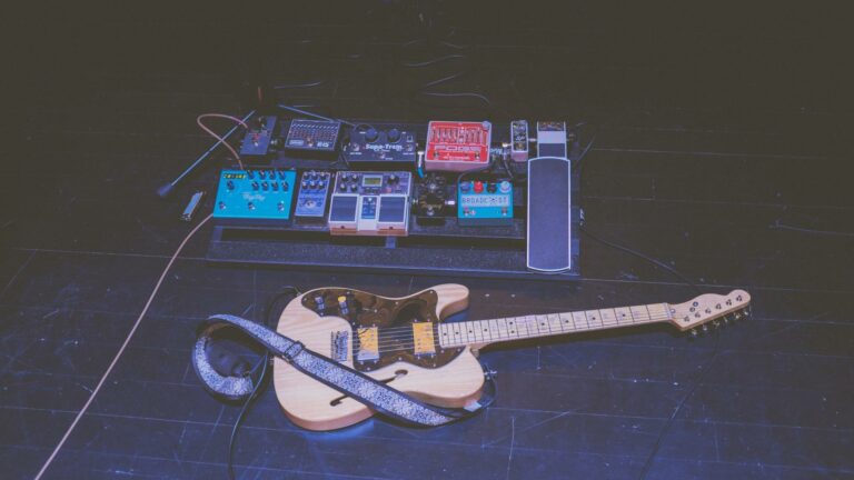 Guitar and pedalboard setup showcasing creative tools for digital marketing strategies