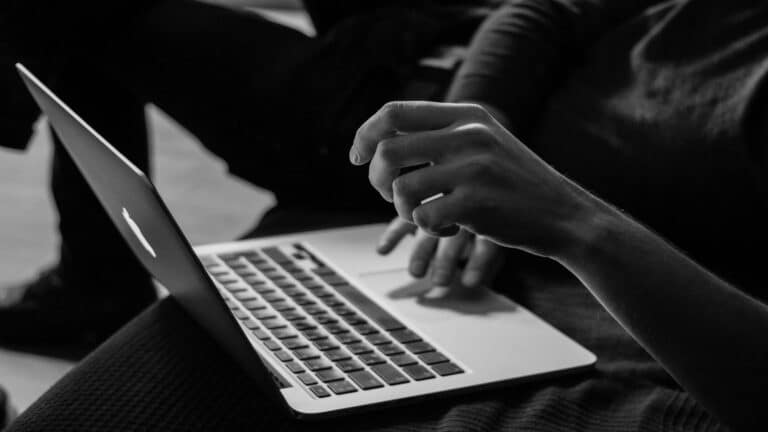 Person working on a laptop to optimize site structure for web design in London