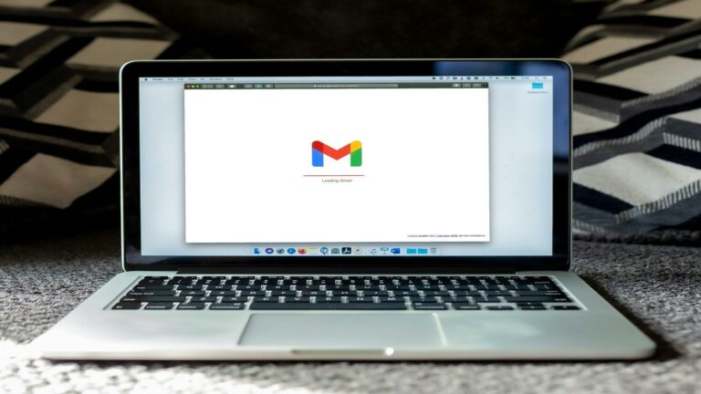 Laptop displaying the Gmail loading screen on its browser.