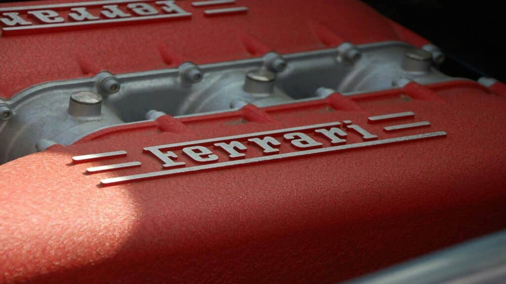 Close-up of a Ferrari engine showcasing the iconic logo for local business listings