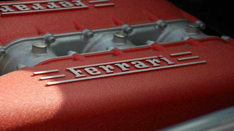 Ferrari engine close-up showcasing the iconic red design and branding