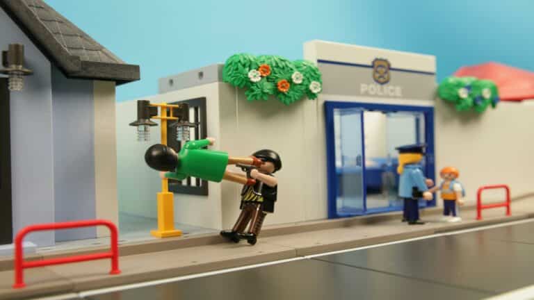 Playmobil figures depicting a dramatic scene outside a police station in London