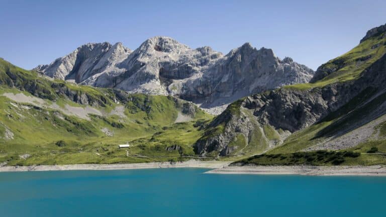 Tranquil mountain landscape with a turquoise lake, showcasing natural beauty and serenity