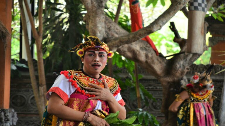 Traditional Balinese performer showcasing cultural attire and expressions during a local marketing campaign