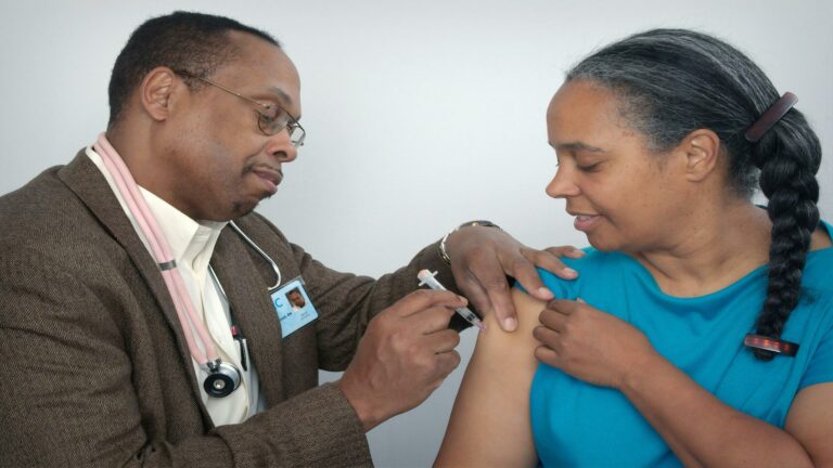 Healthcare professional giving a vaccine to a patient, highlighting trust and care in health services