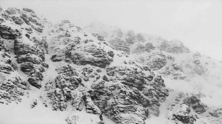 Snow-covered rocky mountain peaks in a misty atmosphere - Web Design London