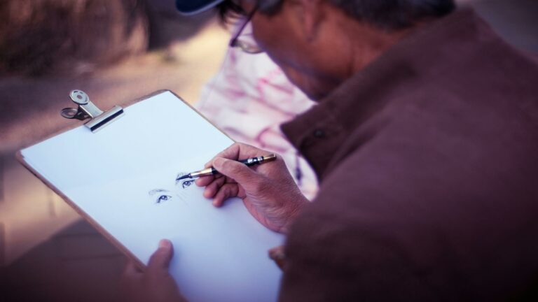 An artist sketching a portrait, showcasing creativity and digital marketing services inspiration