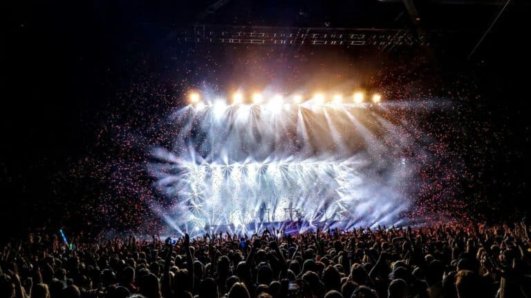 Concert crowd enjoying a live performance with dazzling lights, ideal for local marketing campaigns