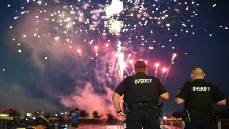 Sheriff deputies monitoring website optimization services event during fireworks celebration