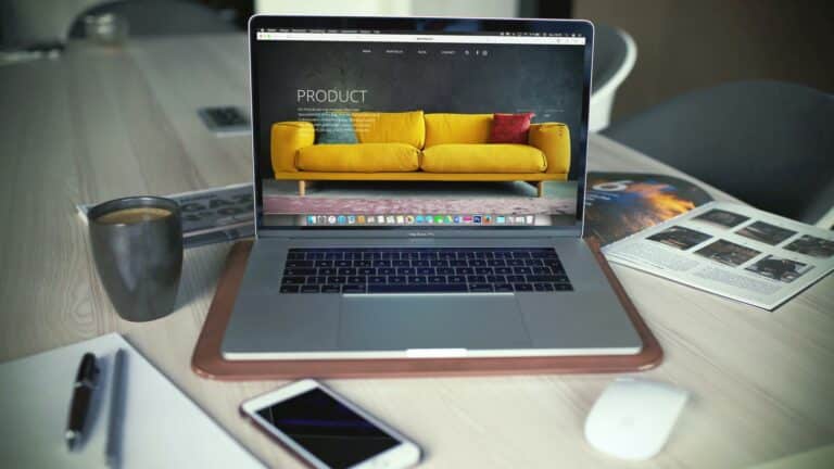 Website navigation optimization displayed on MacBook Pro showing furniture product page with clean menu structure