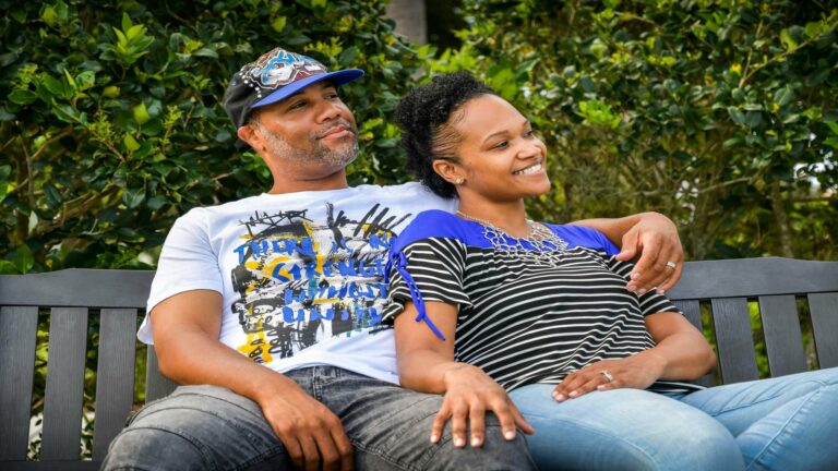 Couple enjoying a serene moment on a bench, symbolizing the harmony of performance optimization techniques in web design.