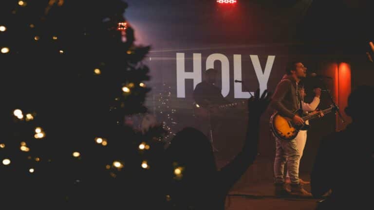 Local marketing campaigns featuring live music performances with a 'Holy' backdrop