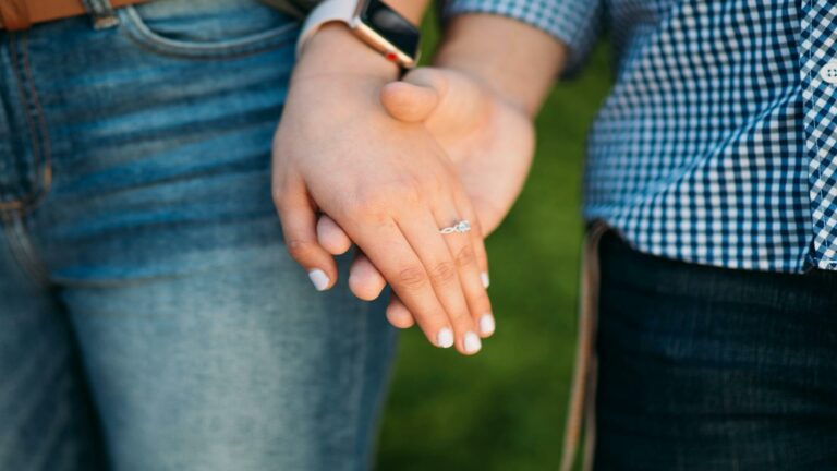 Effective content strategy showcased through a couple holding hands with an engagement ring, symbolizing connection and trust in web design services in London.