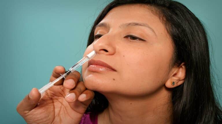 Person holding a syringe representing precision and detail in a web design company