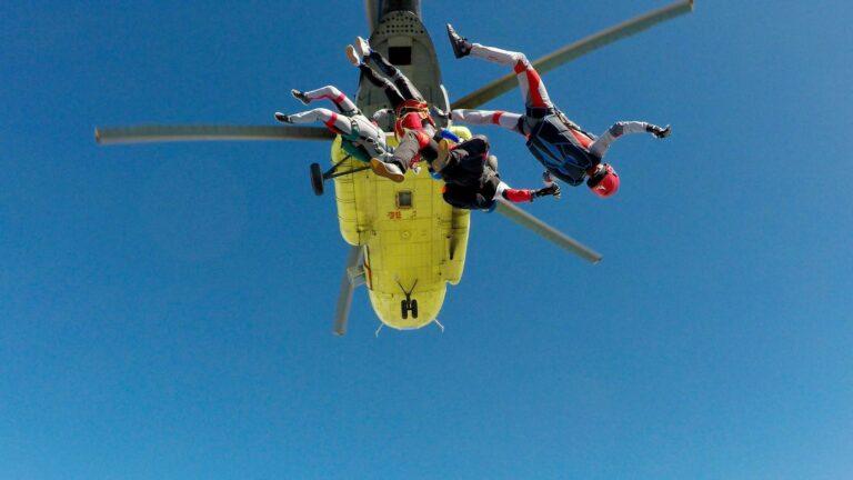 Skydivers jumping from a helicopter during a thrilling adventure