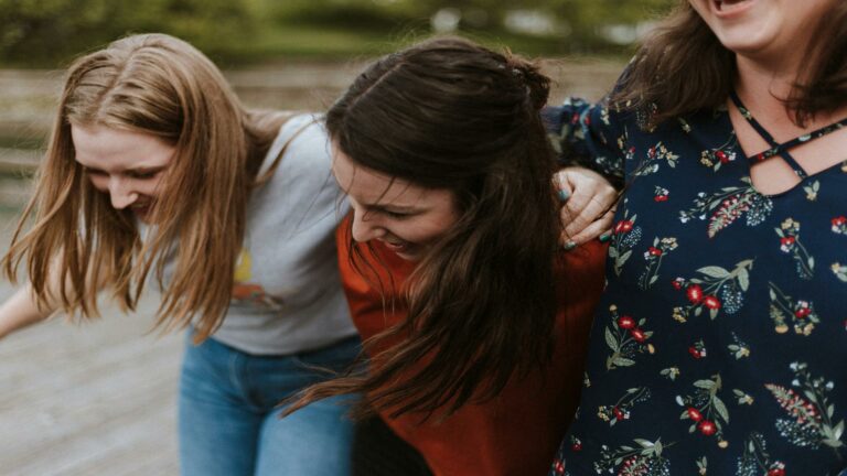 Three individuals enjoying teamwork, representing Web Design London services