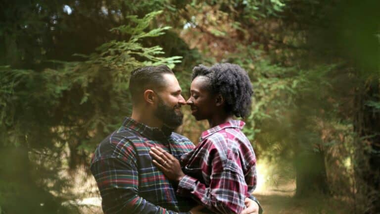 Couple embracing in a forest setting, symbolizing connection and harmony, relevant to effective content strategy