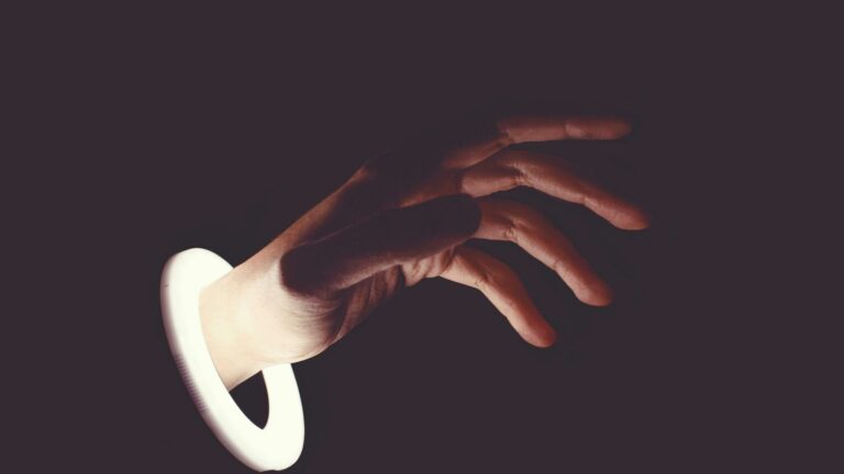 Hand emerging from a digital portal symbolizing online marketing trends